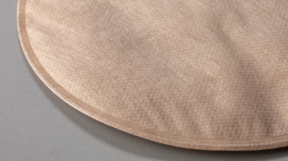 a close-up of an opaque (Tan-colored pouch)